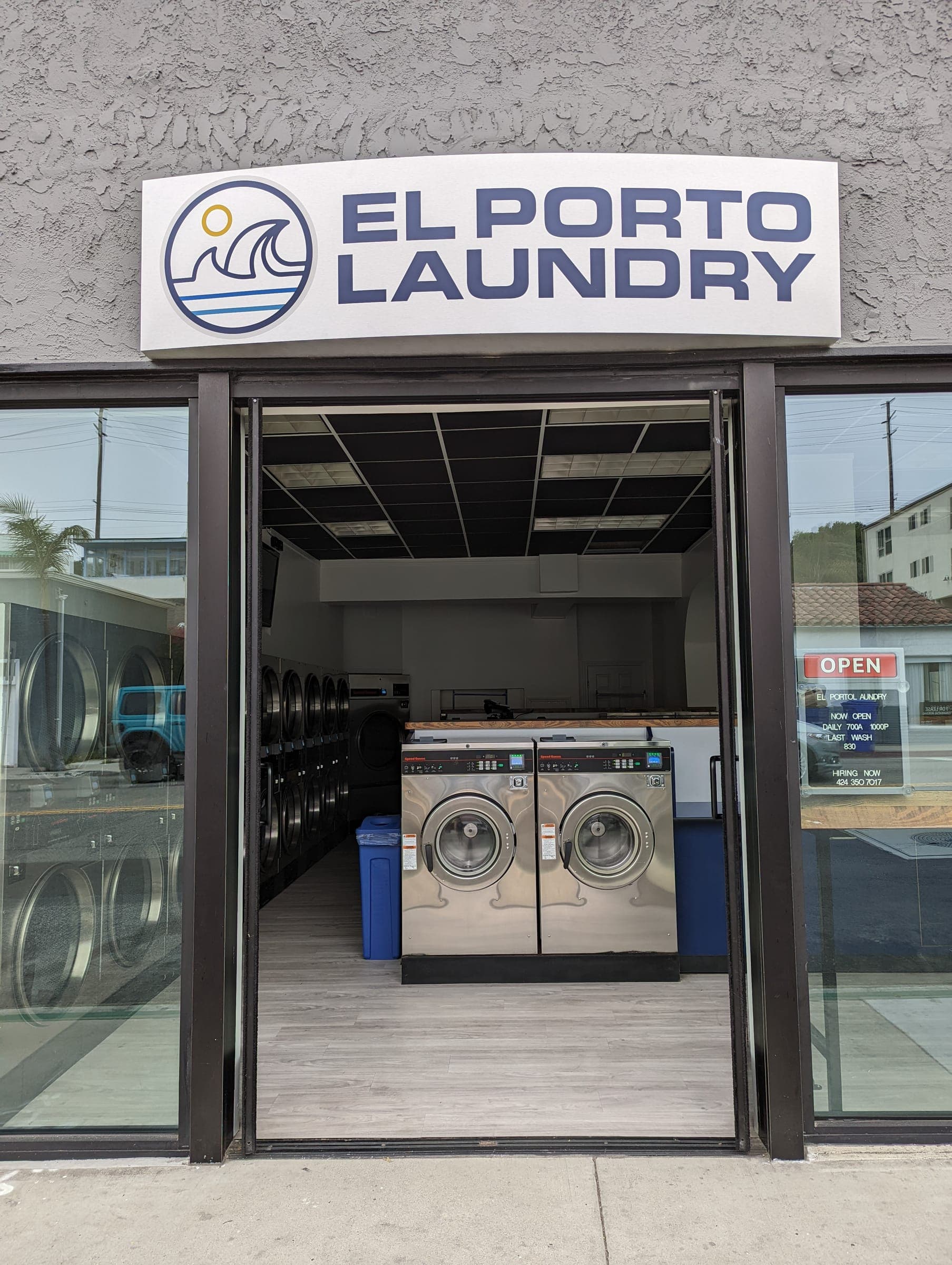 El Porto Laundry front entrance with open sign lit and welcoming