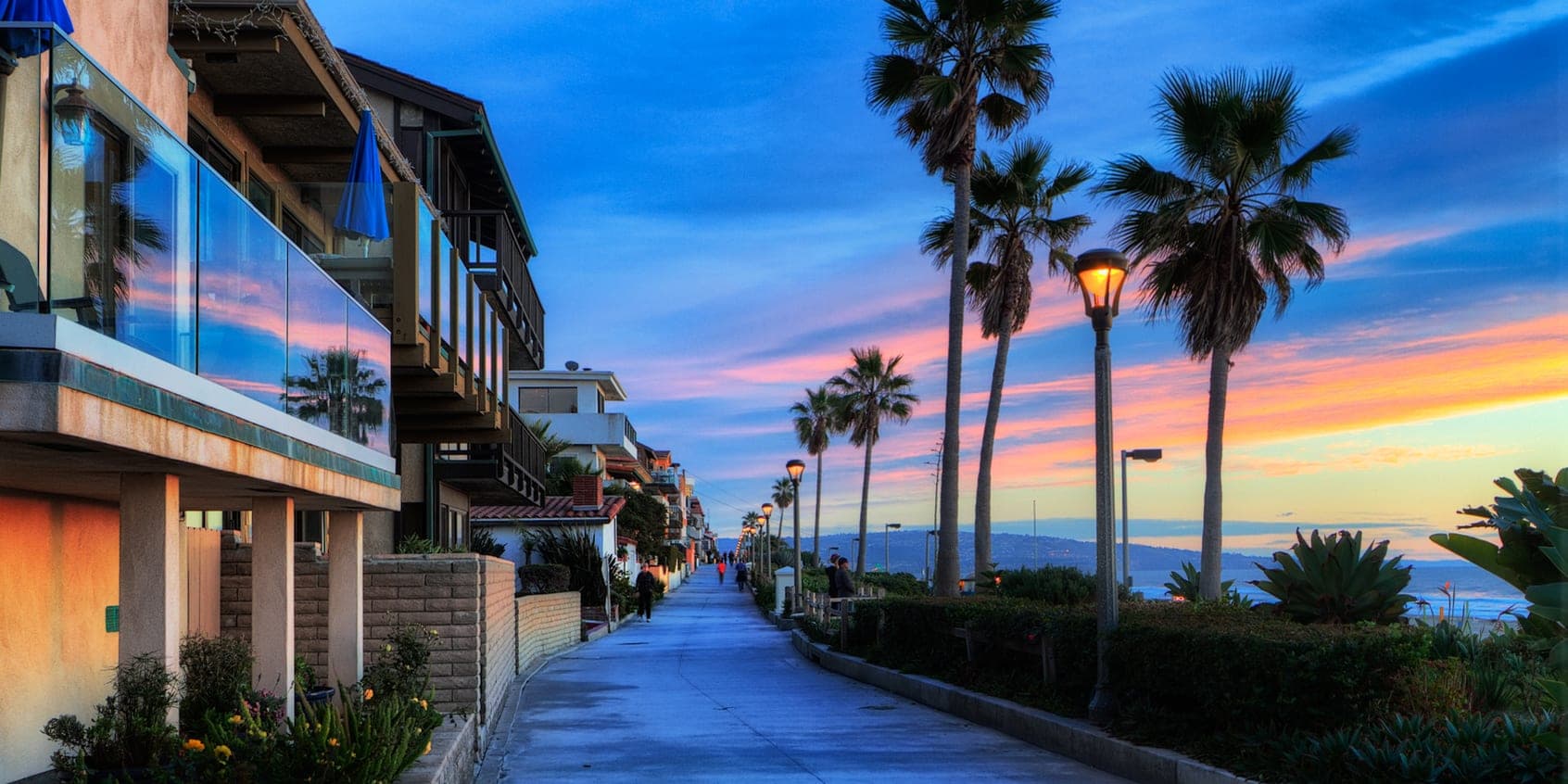 The Strand walkway and beach homes in El Porto, Manhattan Beach at sunset